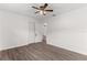 Well-lit bedroom, wood-look floors, and ceiling fan at 46 Lake Court Loop, Ocala, FL 34472