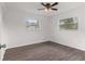 Bright bedroom with wood-look floors and ceiling fan at 46 Lake Court Loop, Ocala, FL 34472