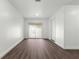 Living room with wood-look floors and sliding glass doors at 46 Lake Court Loop, Ocala, FL 34472