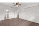Bedroom with wood-look floors and access to bathroom at 46 Lake Court Loop, Ocala, FL 34472