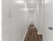 Clean hallway with wood-look flooring and neutral walls at 46 Lake Court Loop, Ocala, FL 34472