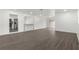 Spacious living area with wood-look flooring and access to patio at 46 Lake Court Loop, Ocala, FL 34472