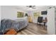 Cozy bedroom with a bed, desk, and plenty of natural light at 5240 Se 17Th St, Ocala, FL 34471