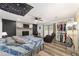 Spacious bedroom with a fireplace, built-in shelving, and sliding glass doors at 5240 Se 17Th St, Ocala, FL 34471