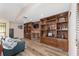 Living room with built-in wooden shelving and a brick fireplace at 5240 Se 17Th St, Ocala, FL 34471
