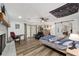 Large bedroom with fireplace, barn door, and sitting area at 5240 Se 17Th St, Ocala, FL 34471