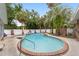 Inviting kidney-shaped pool with a spa and lush landscaping at 5240 Se 17Th St, Ocala, FL 34471