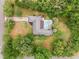 Aerial view of house, pool, and large lot with lush landscaping at 5240 Se 17Th St, Ocala, FL 34471