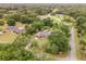 Aerial view of a house with a pool and large yard at 5240 Se 17Th St, Ocala, FL 34471
