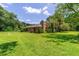 Brick house with a chimney in a large backyard at 5240 Se 17Th St, Ocala, FL 34471