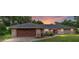 Brick ranch home with dark brown garage door at 5240 Se 17Th St, Ocala, FL 34471