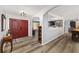 Open entryway with red doors and hardwood floors at 5240 Se 17Th St, Ocala, FL 34471
