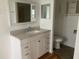 Bathroom with a vanity, toilet, and a mirrored medicine cabinet at 24822 Pine Hl, Leesburg, FL 34748