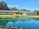 Property features a pond with fountain at 10765 Sw 62Nd Ter, Ocala, FL 34476
