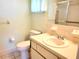 Bathroom with a toilet, sink, and shower at 10765 Sw 62Nd Ter, Ocala, FL 34476