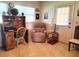 Home office with a wooden desk, chair, and recliner at 10765 Sw 62Nd Ter, Ocala, FL 34476