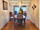Dining room with a round wooden table and four chairs at 10765 Sw 62Nd Ter, Ocala, FL 34476