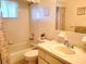 Bathroom with a bathtub, toilet, and sink at 10765 Sw 62Nd Ter, Ocala, FL 34476
