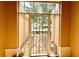 View of the front door through a glass entryway at 16026 Sw 14Th Avenue Rd, Ocala, FL 34473