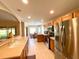 Modern kitchen with stainless steel appliances and a breakfast bar at 16026 Sw 14Th Avenue Rd, Ocala, FL 34473