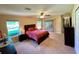 Spacious bedroom with king-size bed and access to backyard at 16026 Sw 14Th Avenue Rd, Ocala, FL 34473