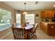 Kitchen features a breakfast nook with wood table and chairs at 16026 Sw 14Th Avenue Rd, Ocala, FL 34473