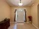 Bright and airy entryway with tile floors, a decorative console table, and a view to the formal dining area at 16026 Sw 14Th Avenue Rd, Ocala, FL 34473