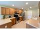 Modern kitchen with stainless steel appliances and wood cabinets at 16026 Sw 14Th Avenue Rd, Ocala, FL 34473