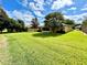 Large backyard with green space and neighboring houses visible at 16026 Sw 14Th Avenue Rd, Ocala, FL 34473