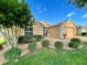 House with manicured lawn, landscaping, and a large tree at 16026 Sw 14Th Avenue Rd, Ocala, FL 34473