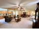 Spacious living area with open floor plan, showing kitchen, dining, and seating areas at 16026 Sw 14Th Avenue Rd, Ocala, FL 34473