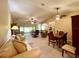 Bright and airy living room with open floor plan, views to kitchen and dining area at 16026 Sw 14Th Avenue Rd, Ocala, FL 34473