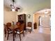Dining room features a wood table and chairs, a hutch, and views of the entryway at 16026 Sw 14Th Avenue Rd, Ocala, FL 34473
