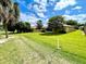 Spacious backyard with lush green grass and mature trees at 16026 Sw 14Th Avenue Rd, Ocala, FL 34473