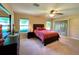 Spacious bedroom with king-size bed and access to backyard at 16026 Sw 14Th Avenue Rd, Ocala, FL 34473