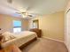 Bright bedroom with ceiling fan and large window at 16026 Sw 14Th Avenue Rd, Ocala, FL 34473