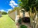 Side view of house showcasing landscaping and green grass at 16026 Sw 14Th Avenue Rd, Ocala, FL 34473