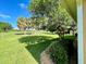 Landscaped backyard with a view of a golf course at 16026 Sw 14Th Avenue Rd, Ocala, FL 34473