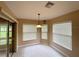 Bright breakfast nook with wood table and chairs, view of backyard at 16026 Sw 14Th Avenue Rd, Ocala, FL 34473