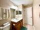 Clean bathroom with vanity, toilet, and shower/tub combo at 16026 Sw 14Th Avenue Rd, Ocala, FL 34473