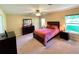 Spacious bedroom with king-size bed and access to backyard at 16026 Sw 14Th Avenue Rd, Ocala, FL 34473