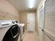 Laundry room with Samsung washer and dryer and built-in shelving at 16026 Sw 14Th Avenue Rd, Ocala, FL 34473