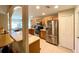 Modern kitchen with stainless steel appliances and light wood cabinets at 16026 Sw 14Th Avenue Rd, Ocala, FL 34473