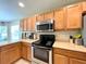 Kitchen with stainless steel appliances and ample counter space at 16026 Sw 14Th Avenue Rd, Ocala, FL 34473