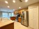 Kitchen with stainless steel appliances and light wood cabinets at 16026 Sw 14Th Avenue Rd, Ocala, FL 34473