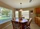 Kitchen features a breakfast nook with wood table and chairs at 16026 Sw 14Th Avenue Rd, Ocala, FL 34473
