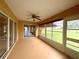 Spacious screened porch overlooking a lush green golf course at 16026 Sw 14Th Avenue Rd, Ocala, FL 34473