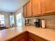 Kitchen counter with coffee maker and breakfast bar at 16026 Sw 14Th Avenue Rd, Ocala, FL 34473
