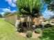 Side of house showing landscaping and a portion of the driveway at 16026 Sw 14Th Avenue Rd, Ocala, FL 34473