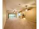 Open and spacious living room with high ceilings, multiple ceiling fans, and an open floor plan at 16026 Sw 14Th Avenue Rd, Ocala, FL 34473